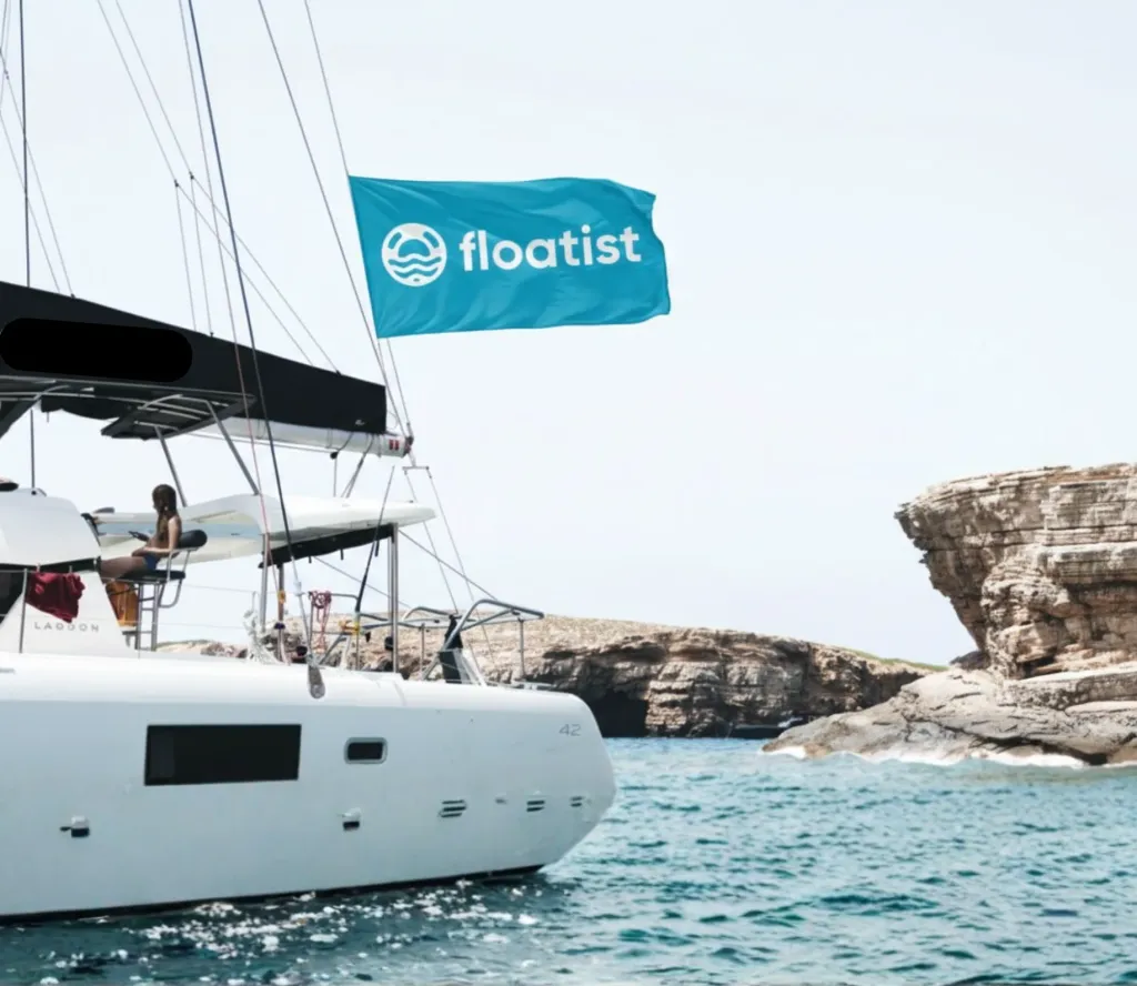 A catamaran sailing under the Floatist flag